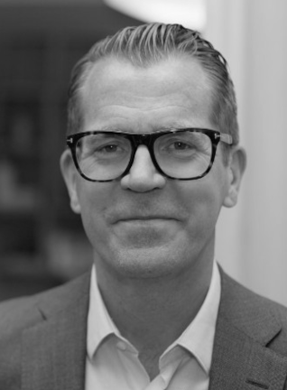 A black and white portrait image of Robert Ekstrom, CEO of CrateDB